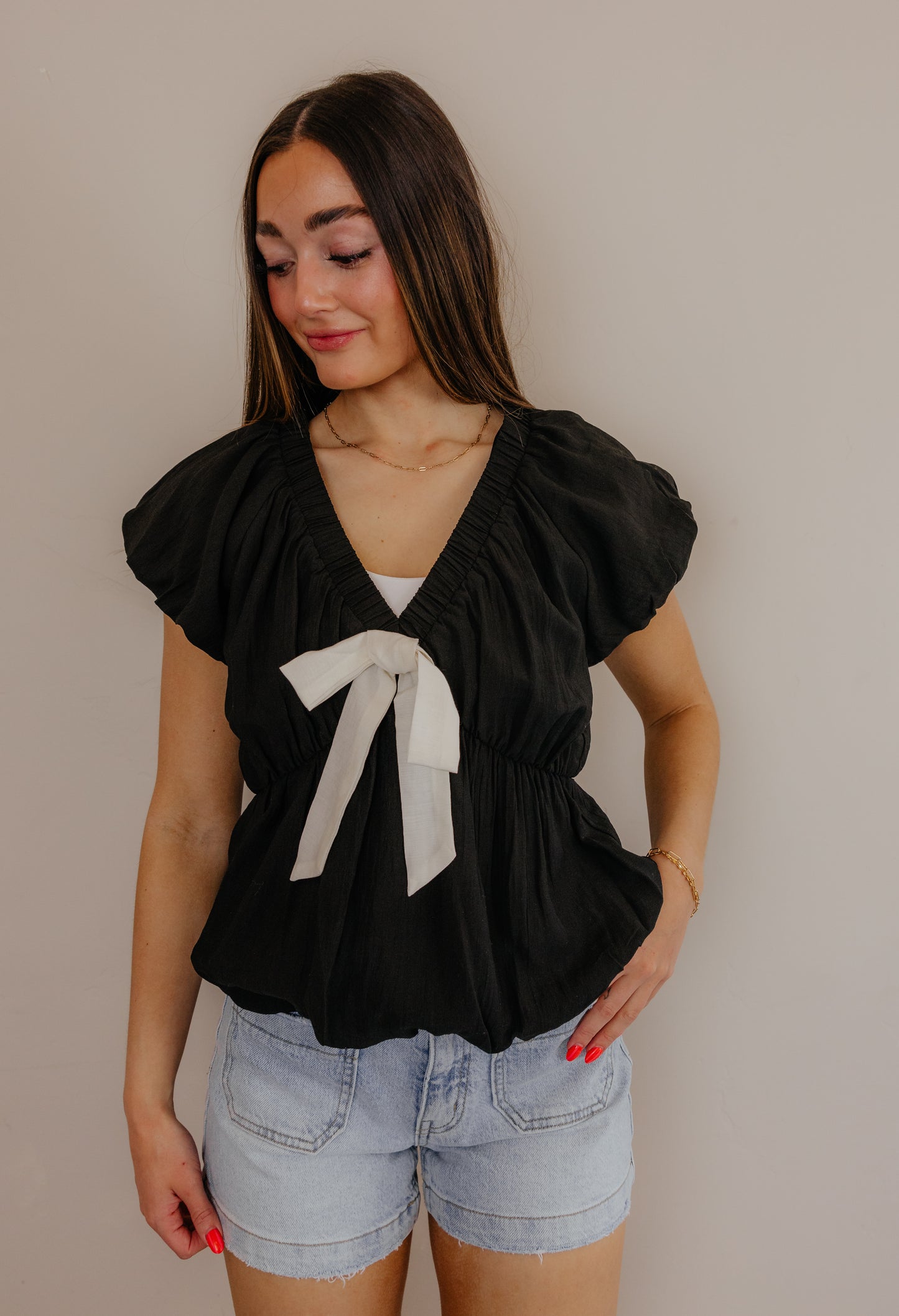 Black V-Neck Blouse with Cream Tie