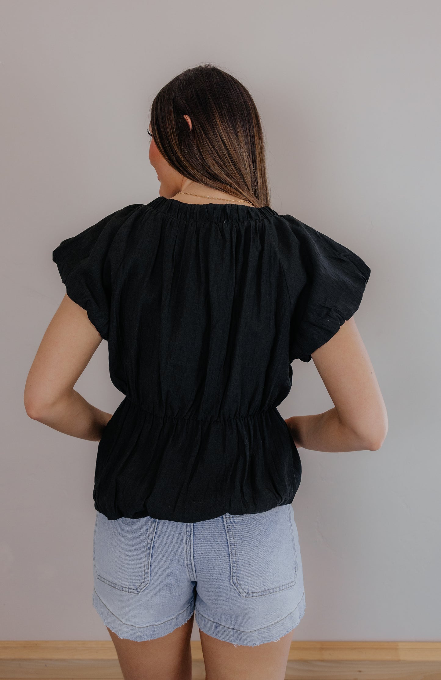 Black V-Neck Blouse with Cream Tie